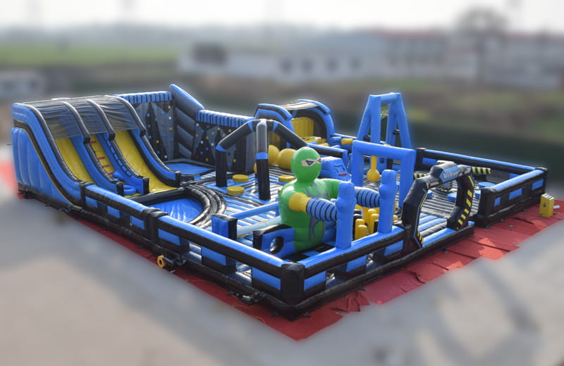 Professional blue and black inflatable ninja obstacle course with climbing walls and tunnels for commercial use.